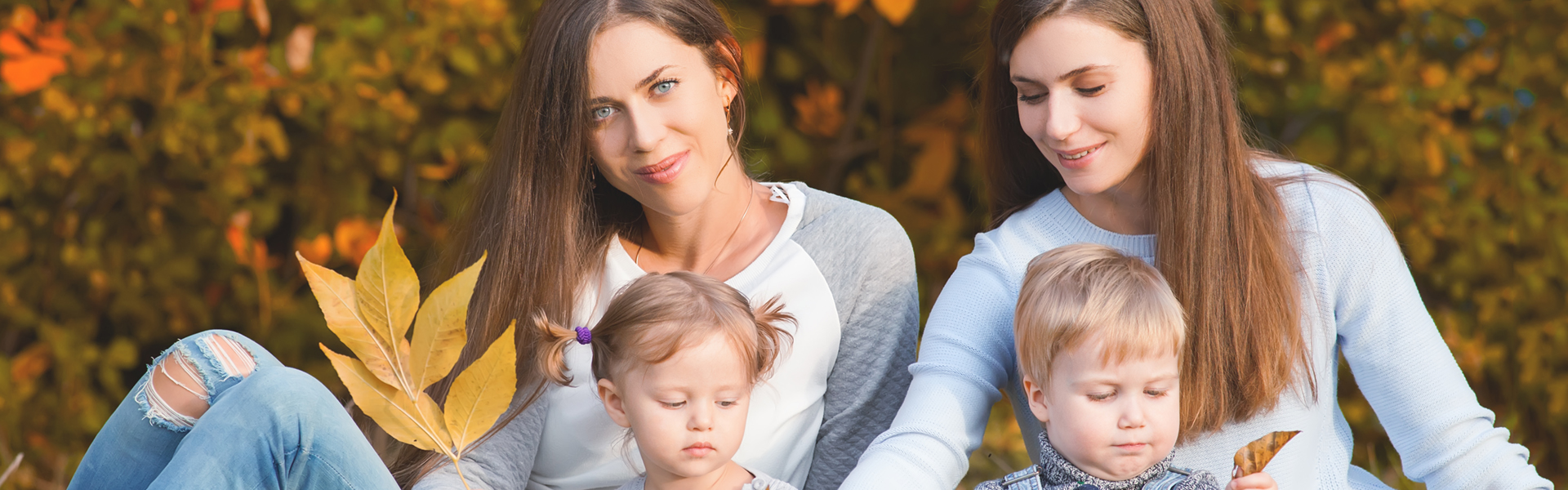 Alternative lesbian family with mothers, daughter and boy outdoor